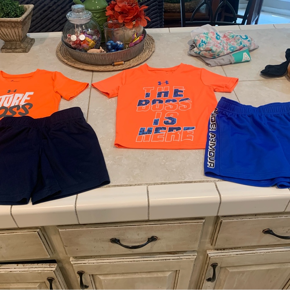 2 shirts and 2 under Armour shorts